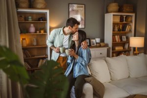 Boyfriend and girlfriend husband and wife drink coffee and enjoy at home