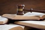 Judge gavel on a pile of booksLaw and justice concept