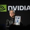 Jensen Huang salah satu pendiri dan CEO Nvidia Corp memegang chip akselerator AI perusahaan untuk pusat data saat berbicara di Nvidia AI Summit Japan di Tokyo Jepang pada hari Rabu 13 November 2024 SoftBank Group Corp akan menjadi pelanggan Nvidia pertama yang membangun superkomputer berdasarkan desain Blackwell baru dari pembuat chip tersebut sebuah langkah untuk memenuhi permintaan yang meningkat di negara yang ingin mengejar ketertinggalan dalam kecerdasan buatan Fotografer Akio KonBloomberg via Getty Images