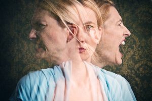 A multi-exposure of an emotional woman