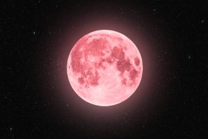 Blue super moon isolated on black background