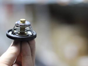 Used car thermostat at warehouse, concept and ideas